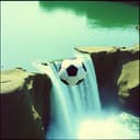 لاعبين كرة قدم وشلال خلفهم